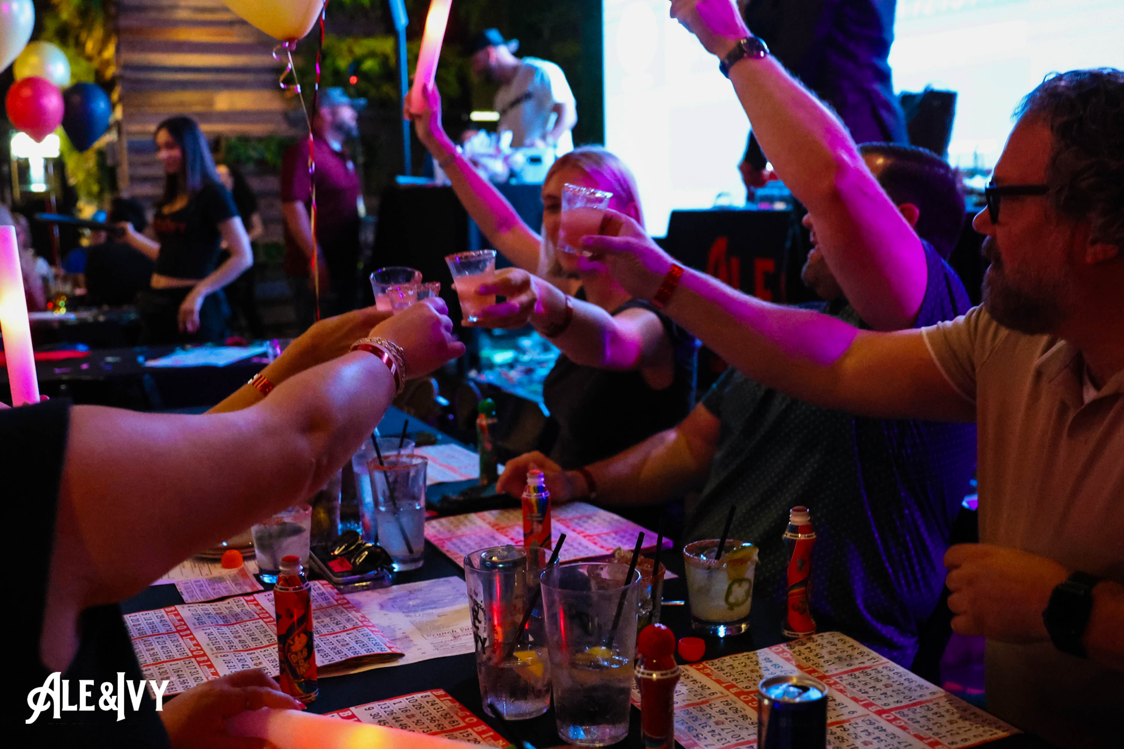 Friends raising a toast at Ale & Ivy